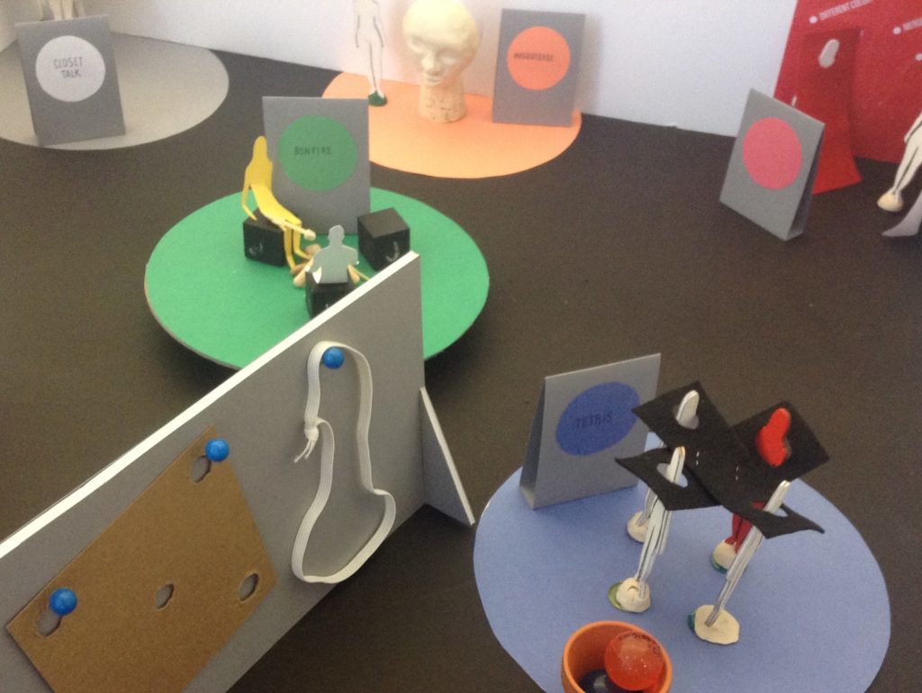 A detail from 'Playing Identities' with the 'Mask' in the background